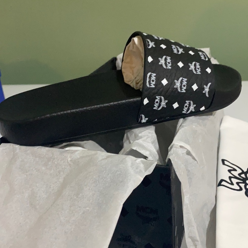 Brand new in box MCM Ram print slide. Never worn